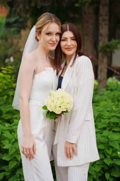 istock A bride with a friend. Comfortable modern wedding wear. 1796422352