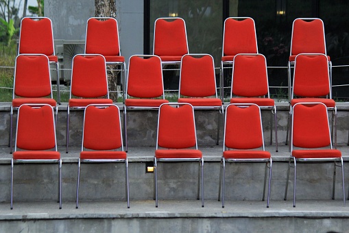 Arranged red chairs were prepared in the outdoor spectator stands.