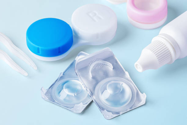 istock Contact lenses closeup with solution bottle and cases on blue background 1796454333