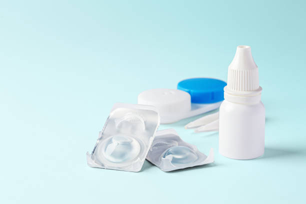 istock Contact lenses with eye drops and accessories on blue background 1796455444