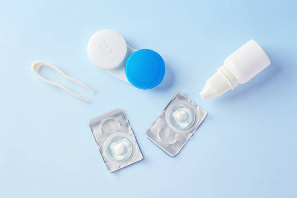 istock Contact lenses and case with eye drops on blue background 1796458150