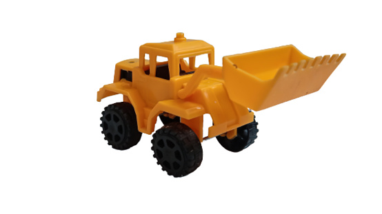 Toy yellow tractor with shovel on white background. Construction machine equipment, banner copy space for text for toy shop.