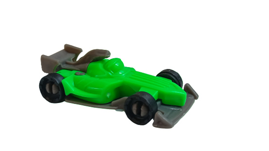 Green racing car toy, isolated on white background
