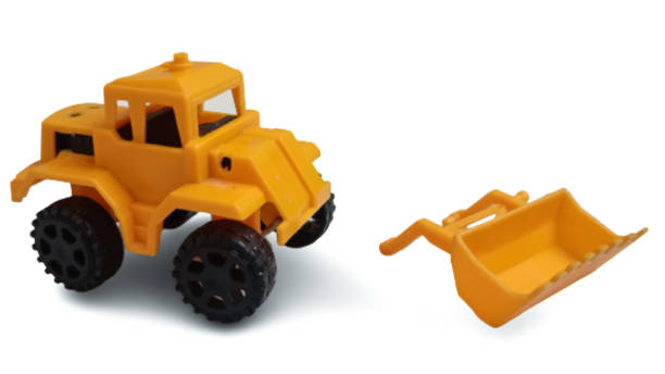 istock Toy yellow tractor with shovel on white background. 1796472149