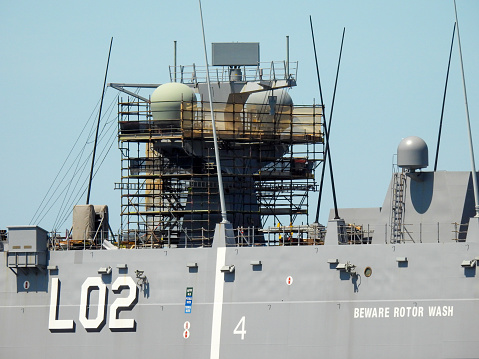 A Canadian Navy ship is docked for repairs/maintenance.