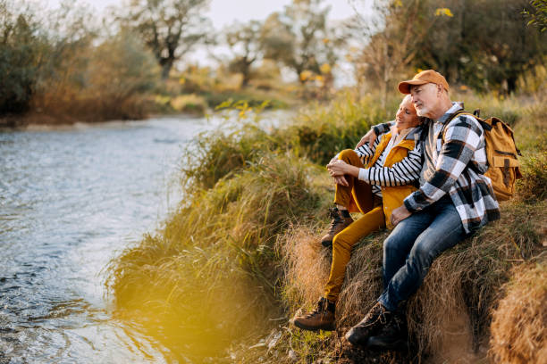 istock Senior couple enjoying sunny day by the river 1796489456