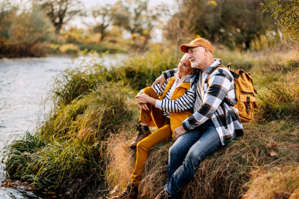 istock Senior couple enjoying sunny day by the river 1796489984