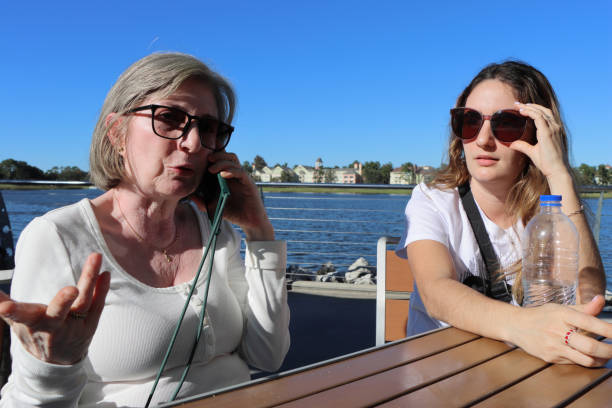 istock Ladies in conversation beside lake 1796490574