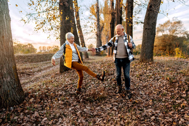 istock Senior couple walking in a nature during sunset 1796498482