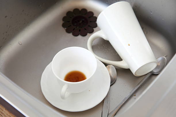 istock Dishwashing. White dishes in the kitchen sink. 179650126