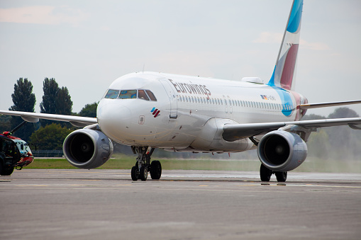 Passenger plane of the German airline Eurowings. European low-cost. Airport apron runway. Germany airplane. Aircraft Airbus A320-214 D-AEWU Airplane arriving. Ukraine, Kyiv - September 1, 2021.
