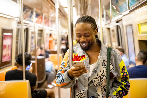 istock Subway rider checking social media on smart phone 1796517291