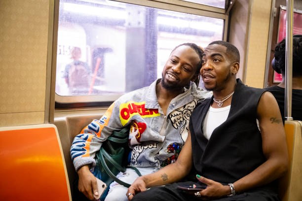 istock Relaxed gay couple riding subway, summertime 1796517292