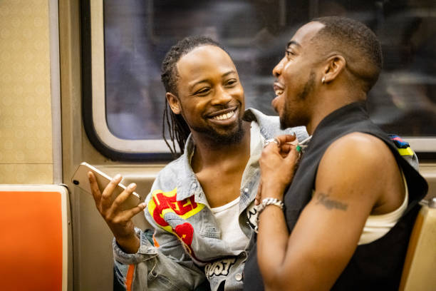 Gay New Yorkers riding subway together