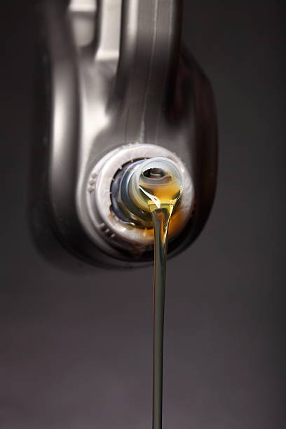 istock Can with car engine oil pouring black background 179652327