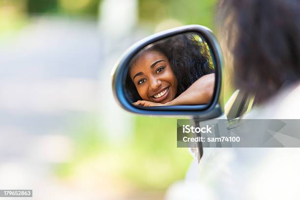 A Teenager In The Rear View Mirror Of Her New Convertible Stock Photo - Download Image Now