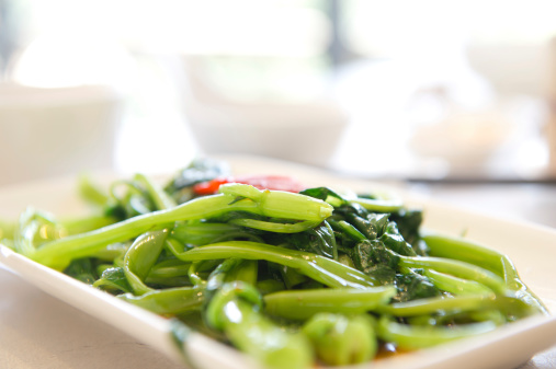 Close-up of a dish of stir fry water convolvulus, Chinese style.