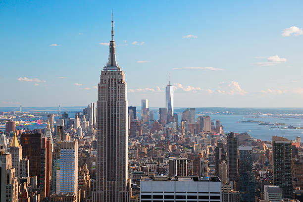 Aerial view of Empire State Building & Manhattan Amazing aerial view of Manhattan dominated by Empire State Building. Far is visible the Statue of Liberty. empire state building photos stock pictures, royalty-free photos & images