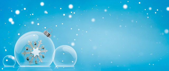 Christmas glass balls on a blue background with space for a copy