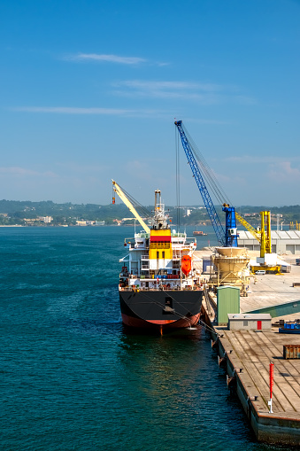 Cargo ship container port & unloading cranes, La Coruna, Galicia, Spain, Europe.