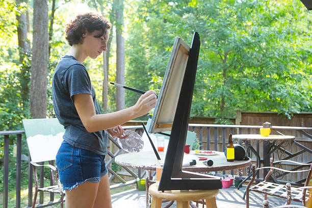 istock Young Woman Painting 179655749