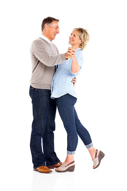 istock Happy mature couple dancing on white 179656266