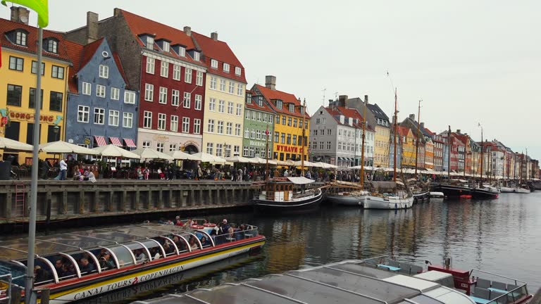 Copenhagen Nyhavn panorama city crowds of people with boats and many small colorful houses