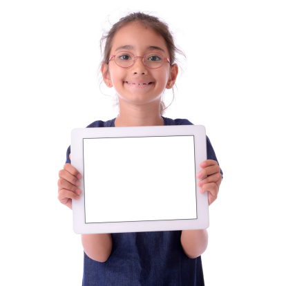 Little girl showing a blank white screen tablet pc. Isolated on white. 
