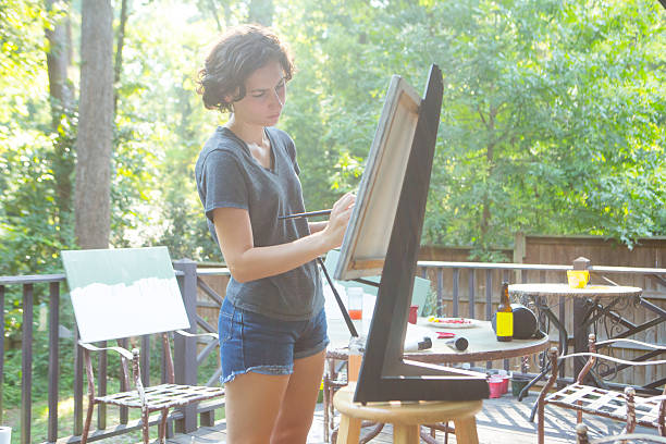 istock Young Woman Painting 179656330