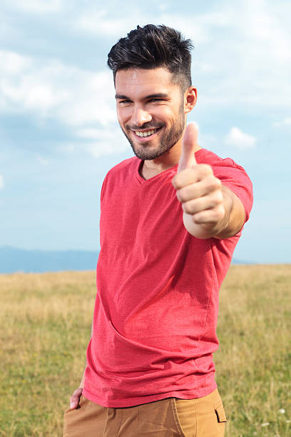 istock casual man shows thumbs up 179657198
