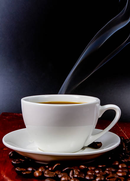 Cup of coffee  on a black background.