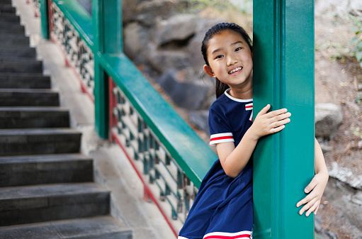 Little girl on Chinese  traditional corridor