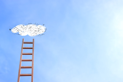 Concept image of ladder reaching the clouds, goal achieving and leadership idea