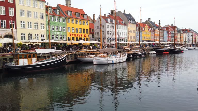 Copenhagen Nyhavn panorama city crowds of people with boats and many small colorful houses