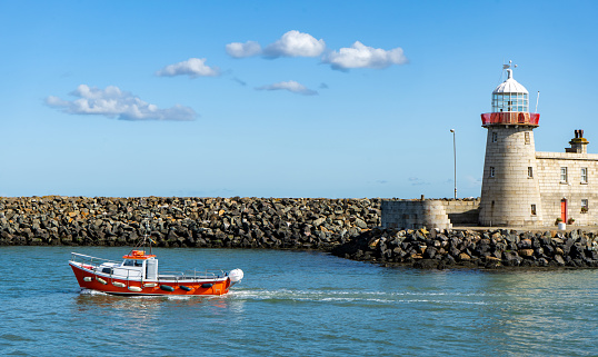 Beautiful seascape - Howth lighthouse with boat