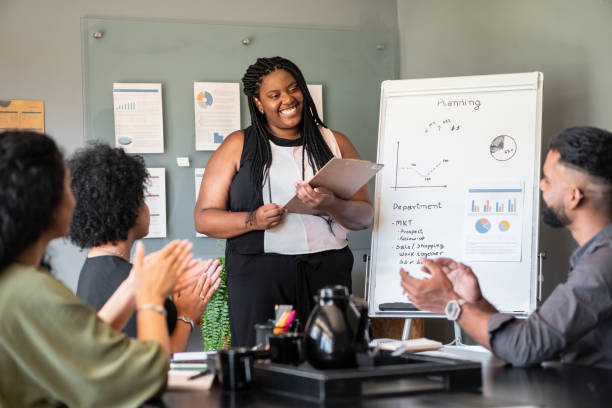 istock Recognition and appreciation. Clapping to Black business woman 1796615265