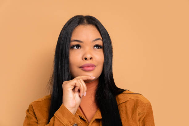 istock interested woman thinking and looking to the side 1796620532