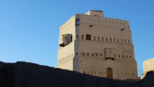 The historic Quba Castle under a bright blue sky in Saudi Arabia