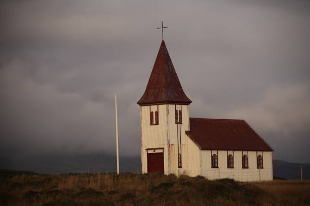 istock small icelandic church with cloudy sky background 1796640130