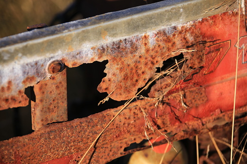 rusty part of abandoned agricultural machinery