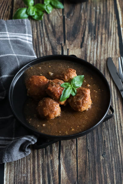 istock Meatballs with tomato sauce . on a wooden table. 1796640695