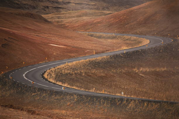istock curvy road on red rocked icelandic ground 1796640697