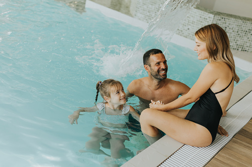 Family enjoy in the indoor swimming pool