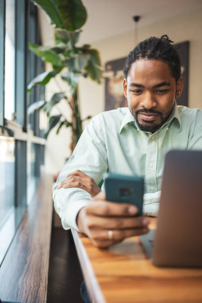 istock Businessman multitasking with his mobile and laptop 1796664580