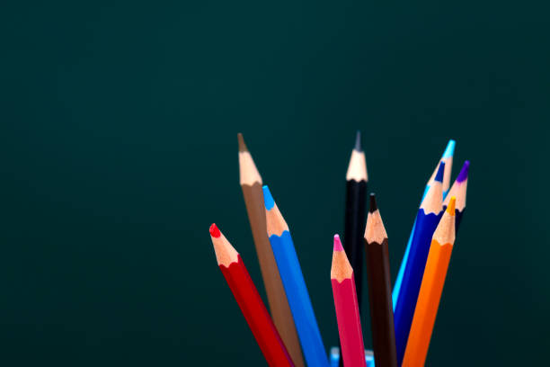 colored pencils on yellow background