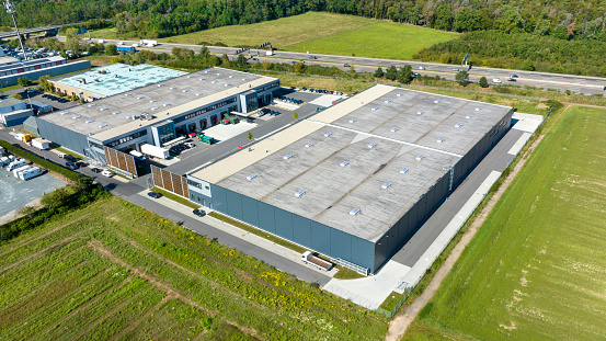 Modern factory building and asphalt floor