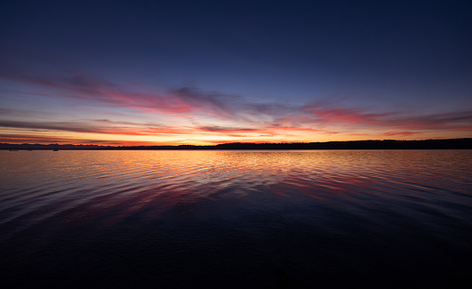 The sky displays a beautiful orange hue during sunrise or sunset.