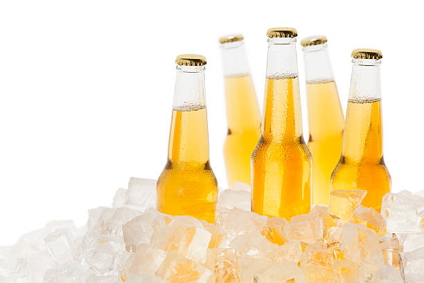 Bottles of beer chilled in ice  http://www.primarypicture.com/iStock/IS_Ice.jpg bucket photos stock pictures, royalty-free photos & images
