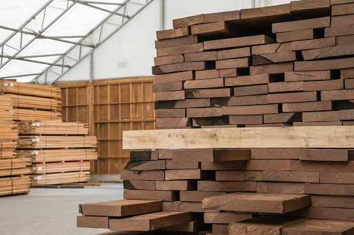 Stacks of lumber being stored in a warehouse