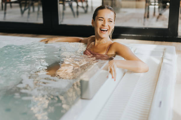 istock Young woman relaxing in the indoor bubble pool 1796708401